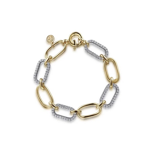 A bracelet featuring alternating large gold and diamond-encrusted silver links, accented with a round clasp and a delicate coin charm.