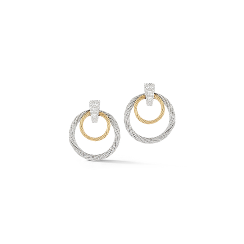 Earrings with two concentric circles: a smaller gold circle inside a larger silver one with textured surfaces.