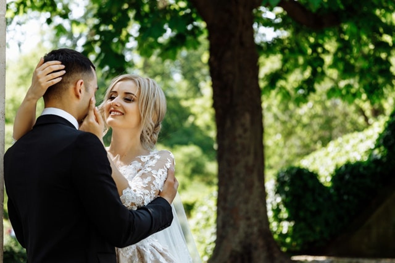 Couple holding each other in forest