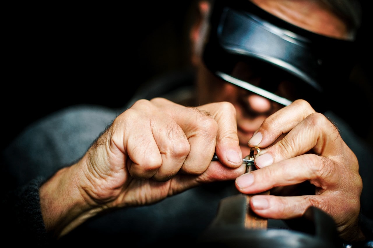 A jeweler working on a piece of jewelry